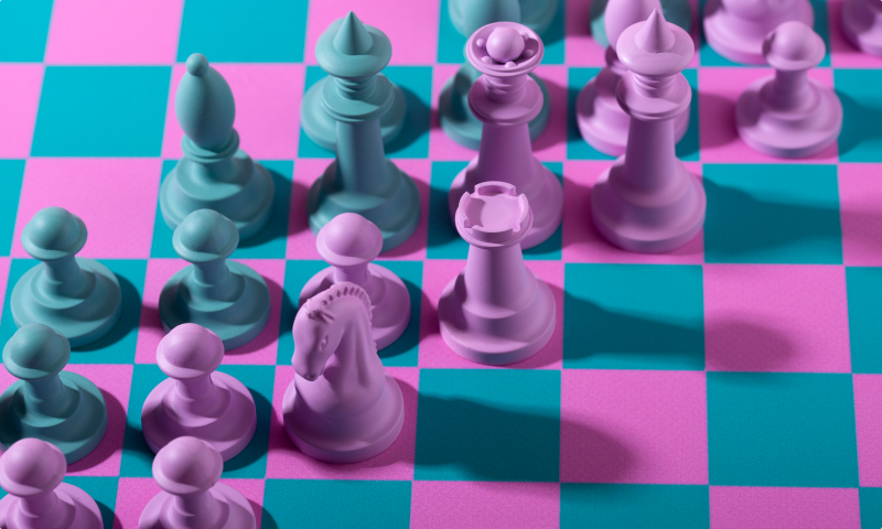 green-pink-pieces-chess-with-game-board.jpg